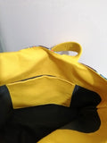 handsewing_yellow_bag